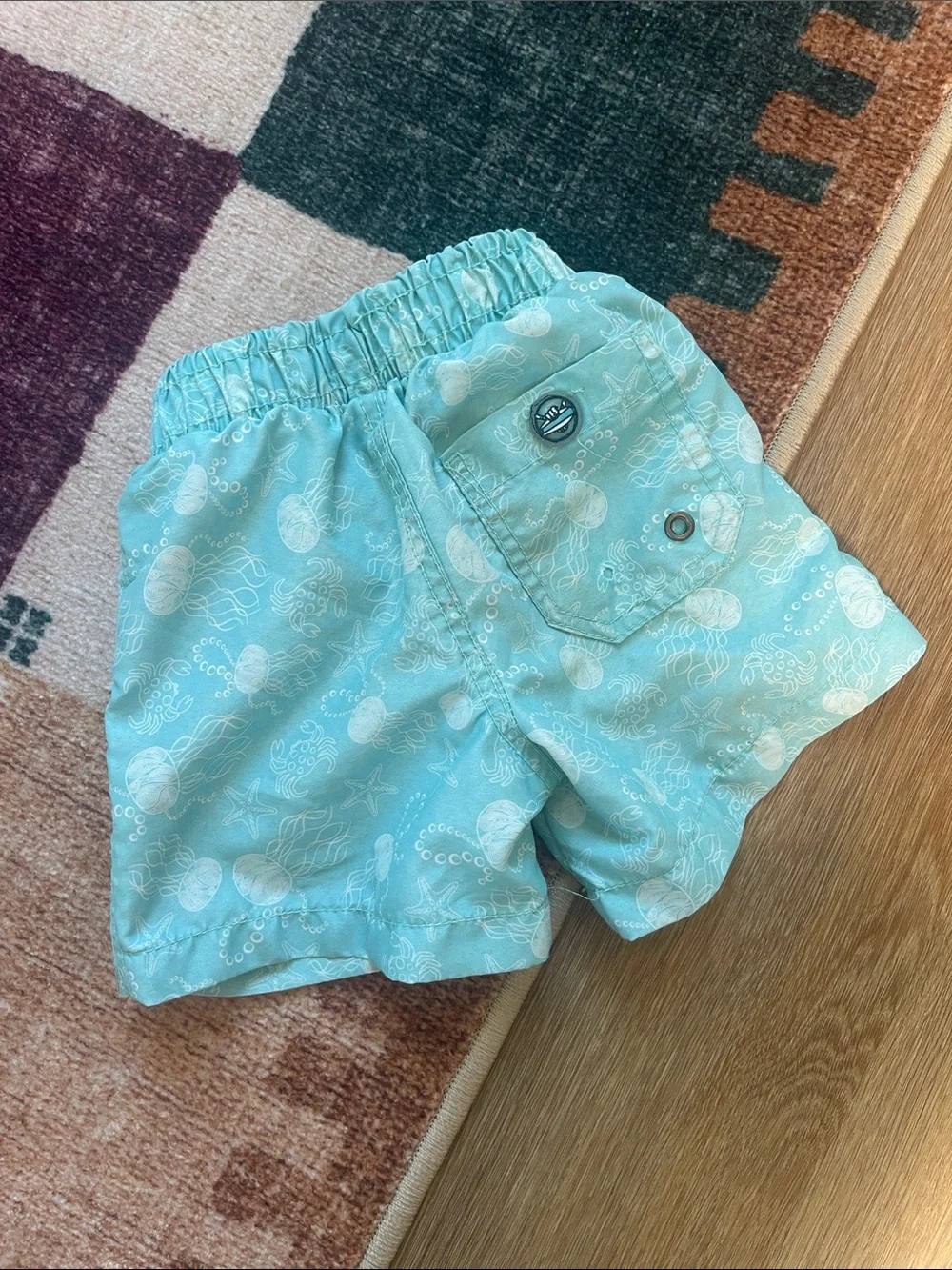 Light Aqua Kids Swim Trunks with Sea Print